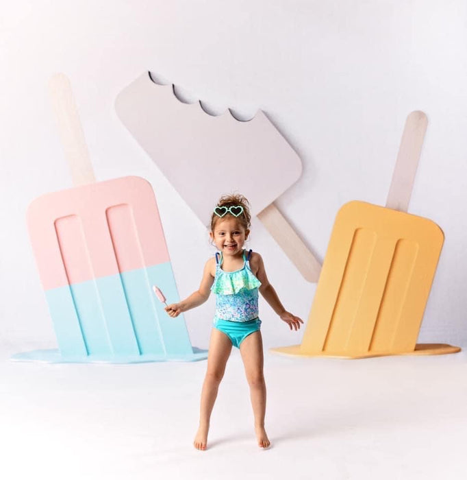 Three Popsicles on White